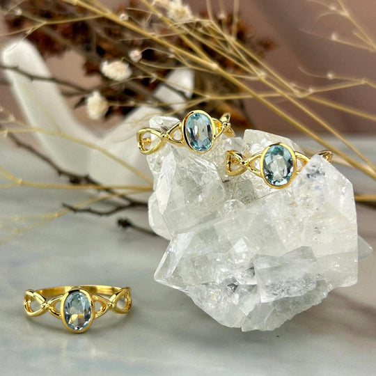 Blue Topaz Cross Wave Gold Ring
