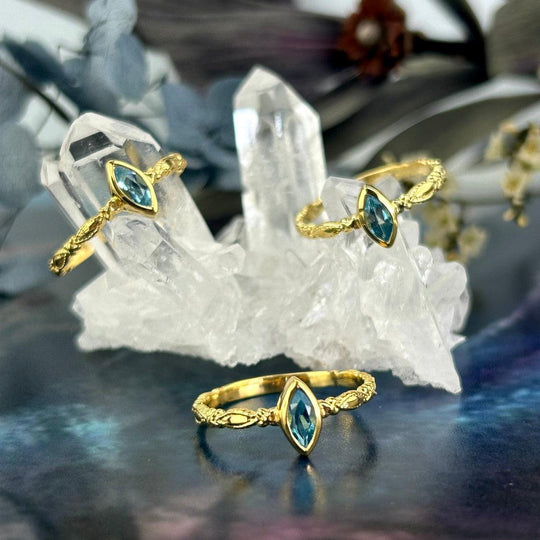 Blue Topaz Marquise Cut Gold Ring
