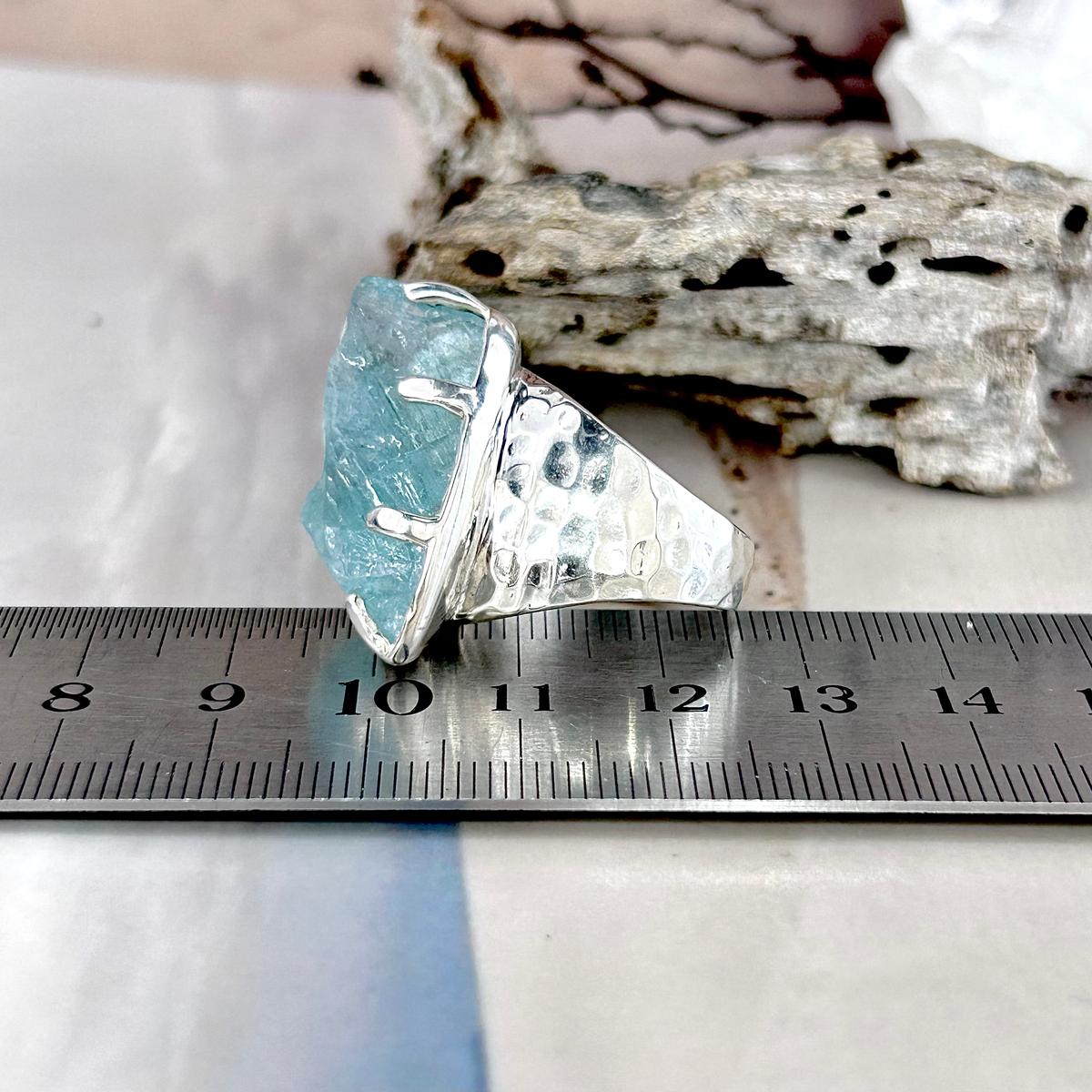 Aquamarine Stone With Rainbow Inclusions