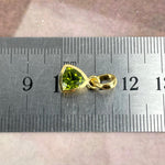 Green Gemstone In Gold Pendant